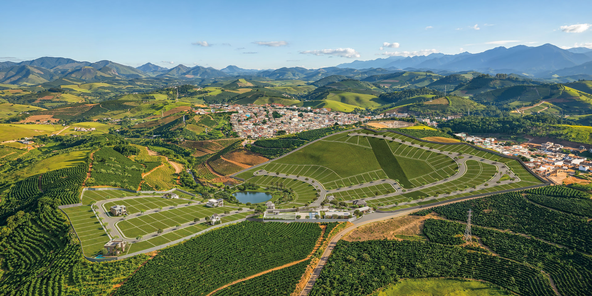Vista aérea do Condomínio Interlagos Residencial em Iúna/ES, com lotes, áreas de lazer e a cidade ao redor